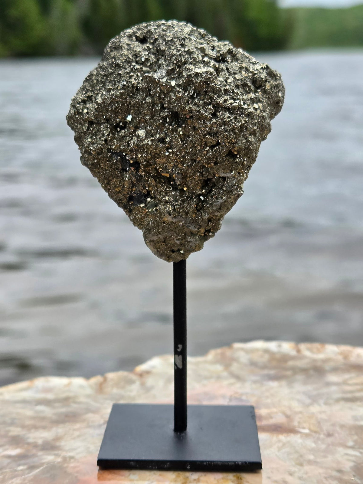 Pyrite cluster on stand side view