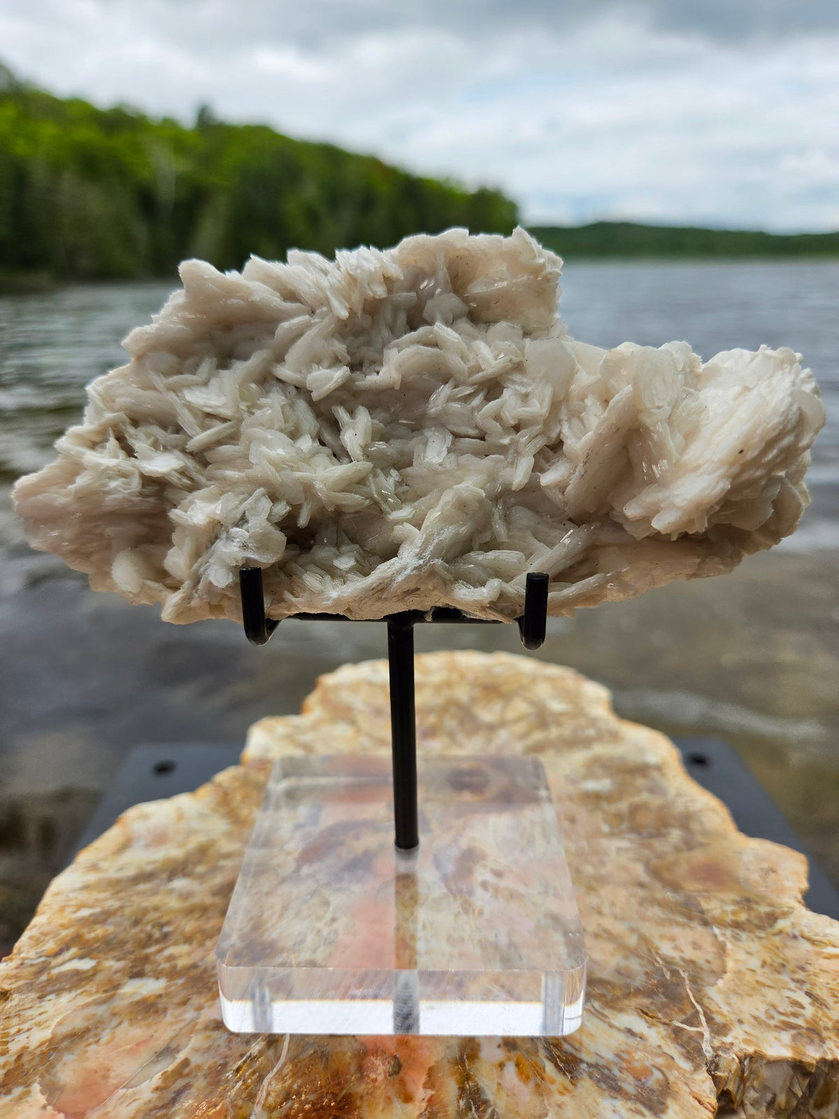 Pink rose petal calcite on stand