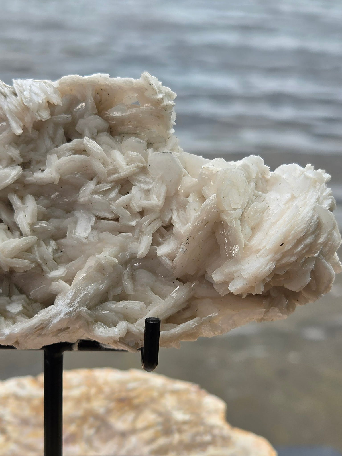 Pink rose petal calcite held in hand