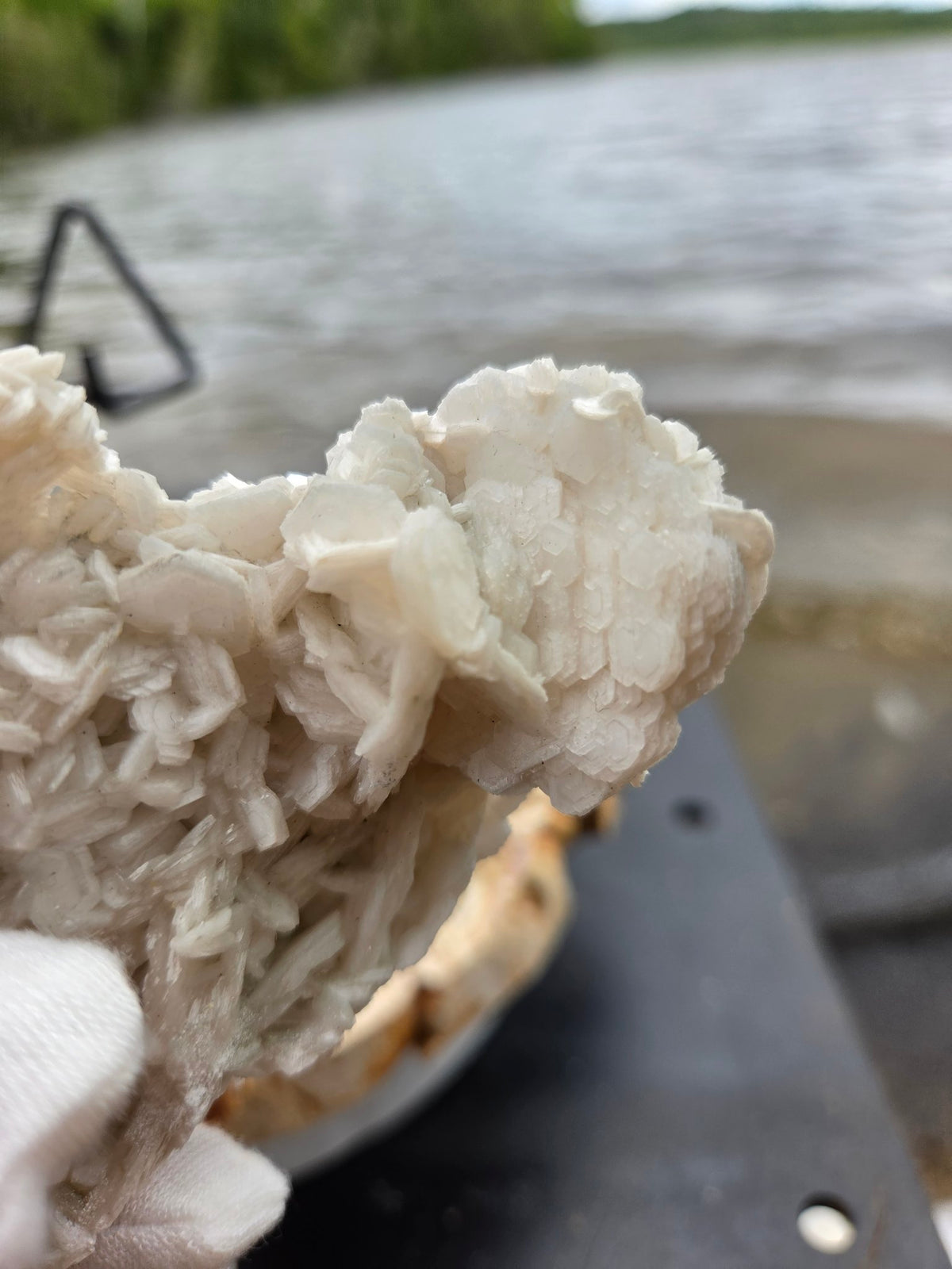 Pink rose petal calcite on stand angle