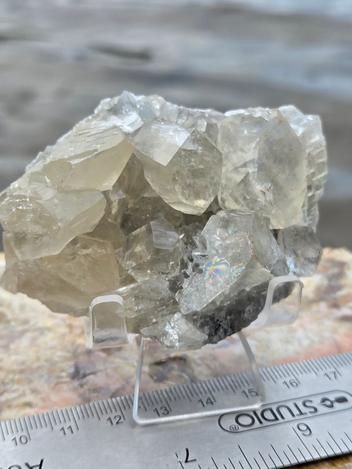 Honey calcite on matrix with ruler