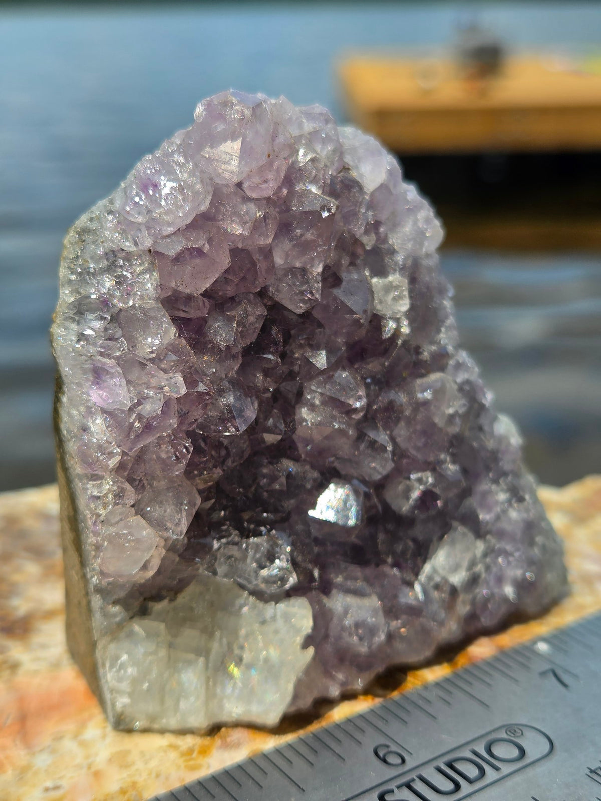Amethyst cluster side view showing calcite