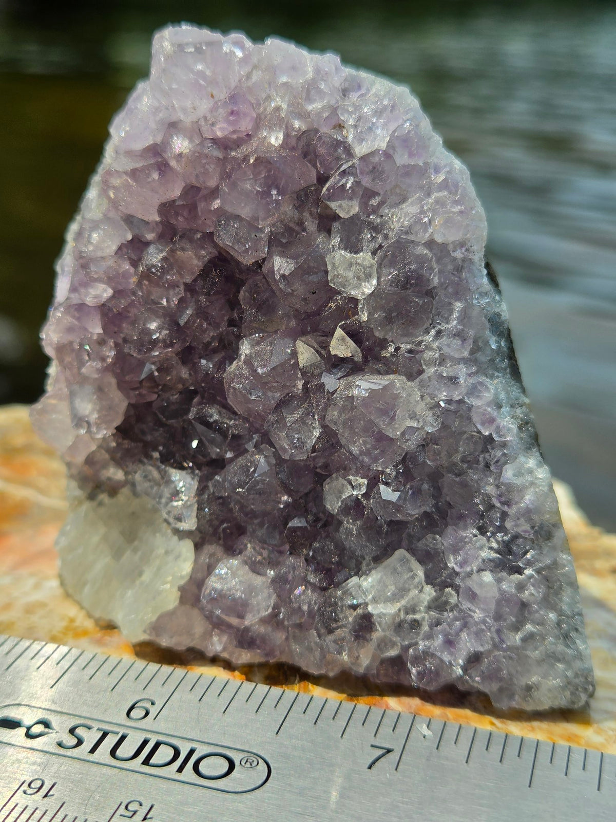 Amethyst cluster with calcite inclusion detail