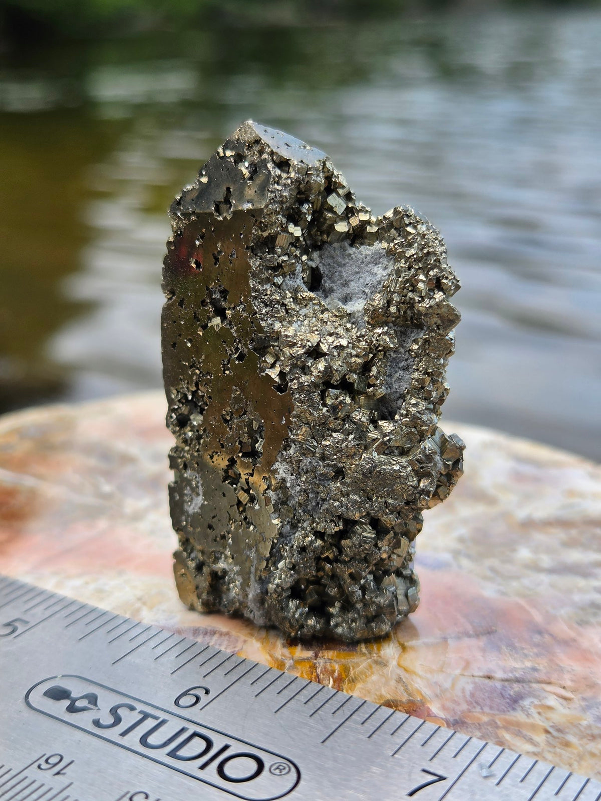 Polished pyrite tower side view