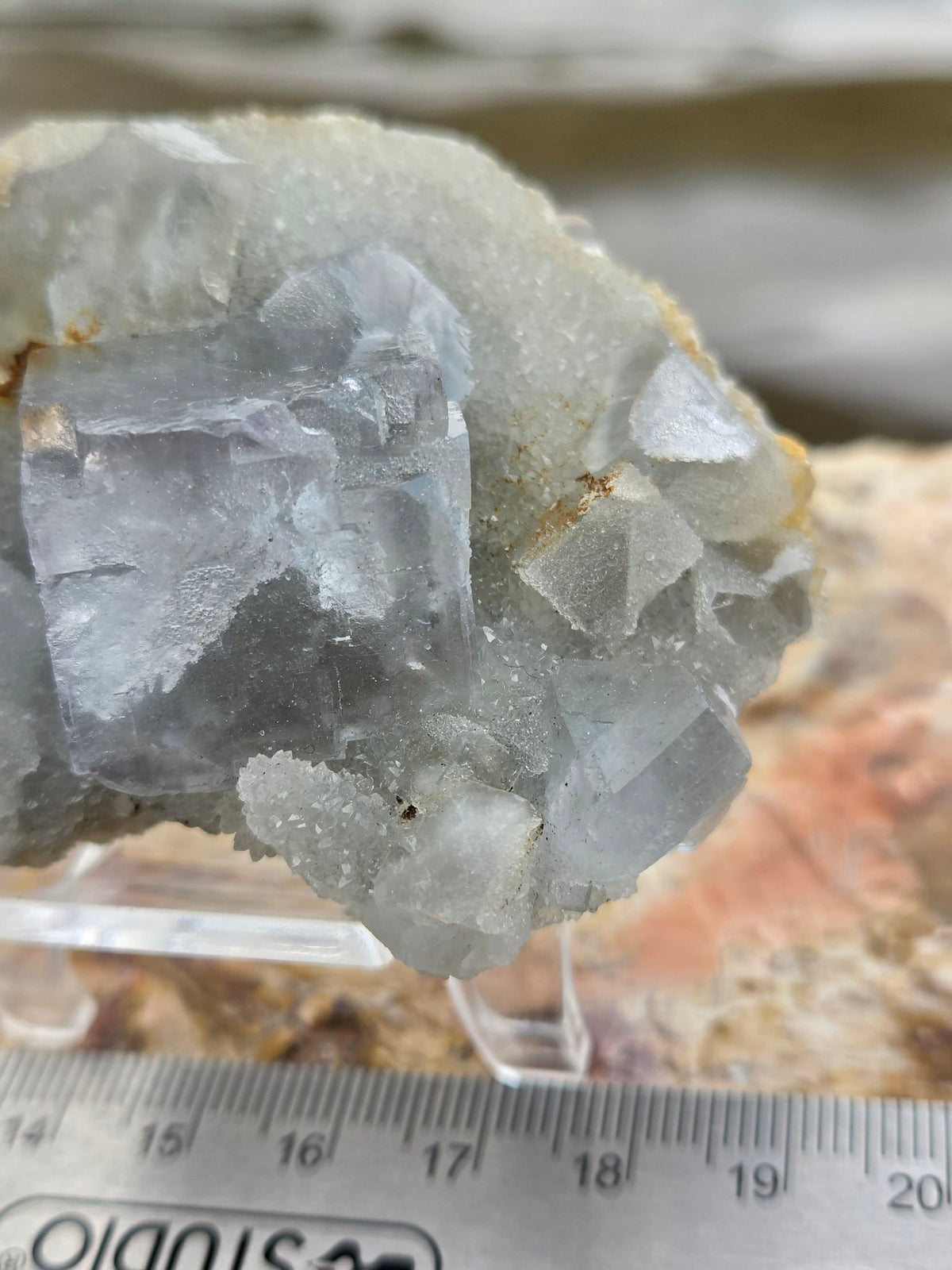 Fluorite cube detail on druzy matrix