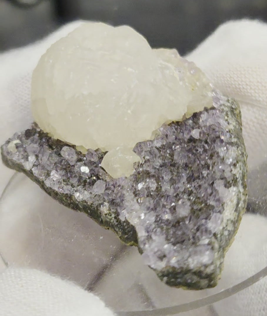 Botryoidal calcite on amethyst cluster specimen