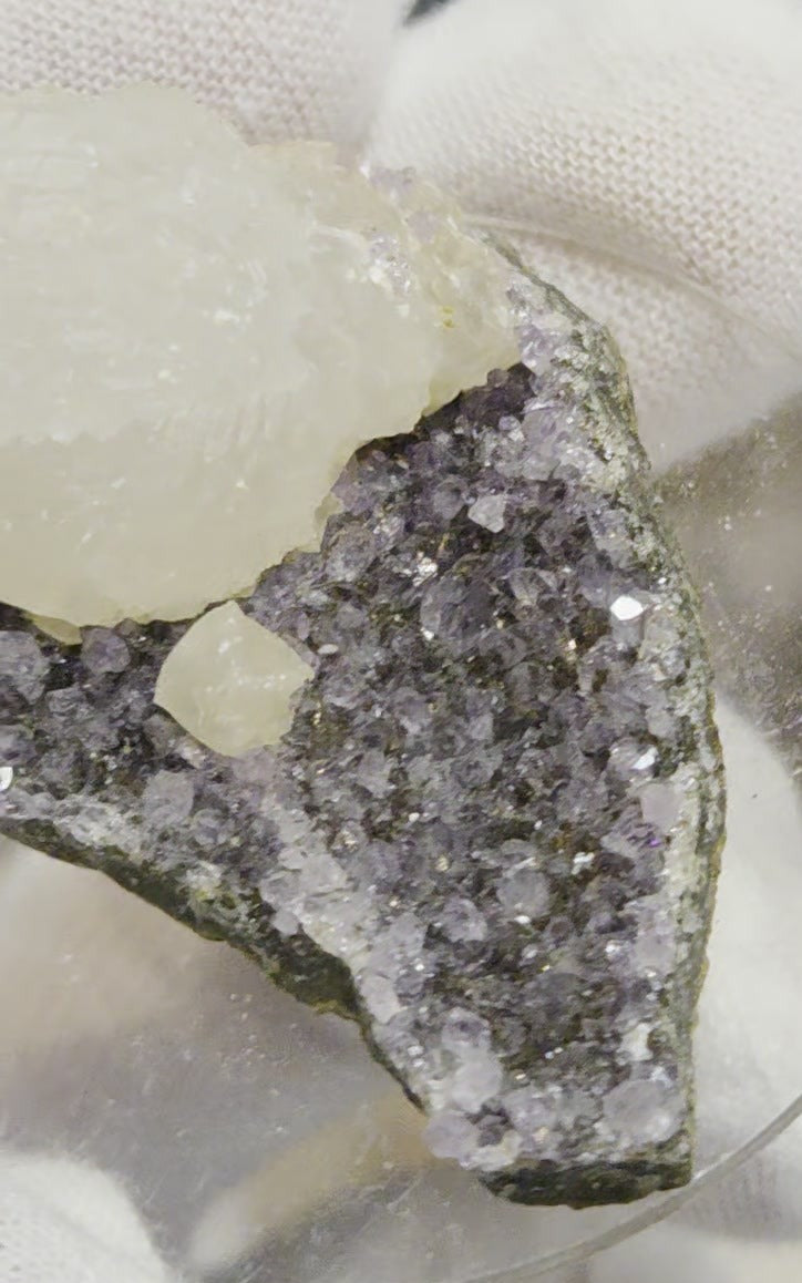 Botryoidal calcite on amethyst cluster specimen