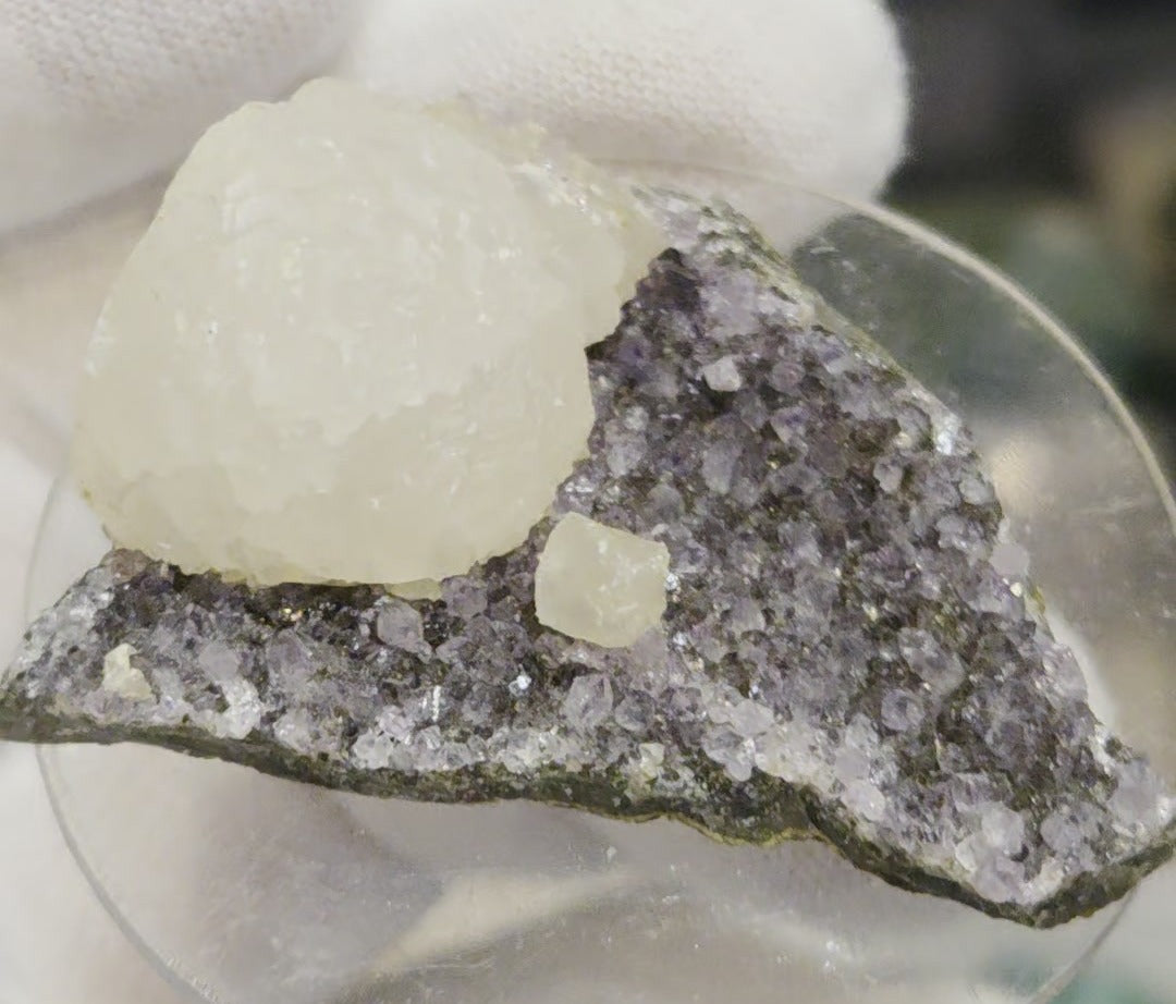 Botryoidal calcite on amethyst cluster specimen