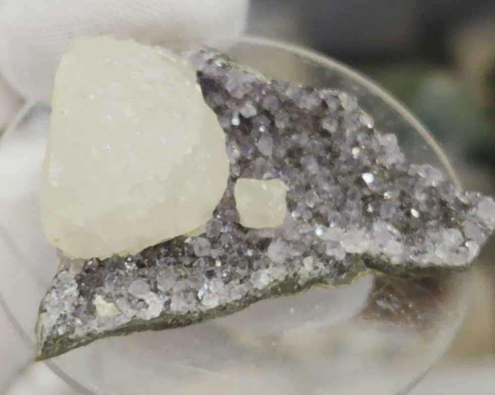 Botryoidal calcite on amethyst cluster specimen