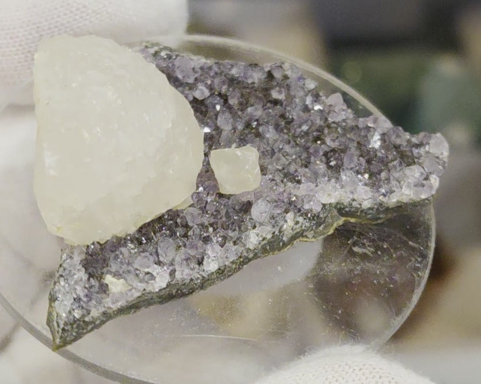 Botryoidal calcite on amethyst cluster specimen