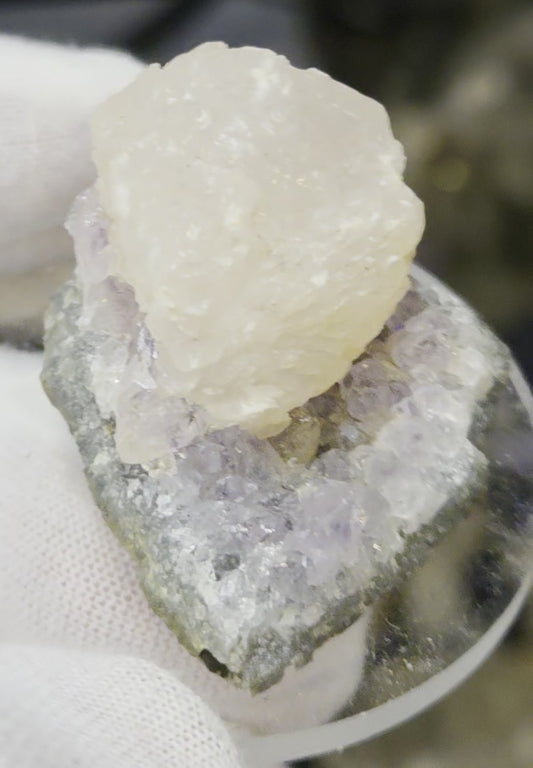 Botryoidal calcite on amethyst cluster specimen