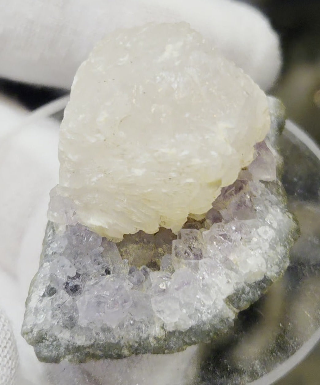 Botryoidal calcite on amethyst cluster specimen