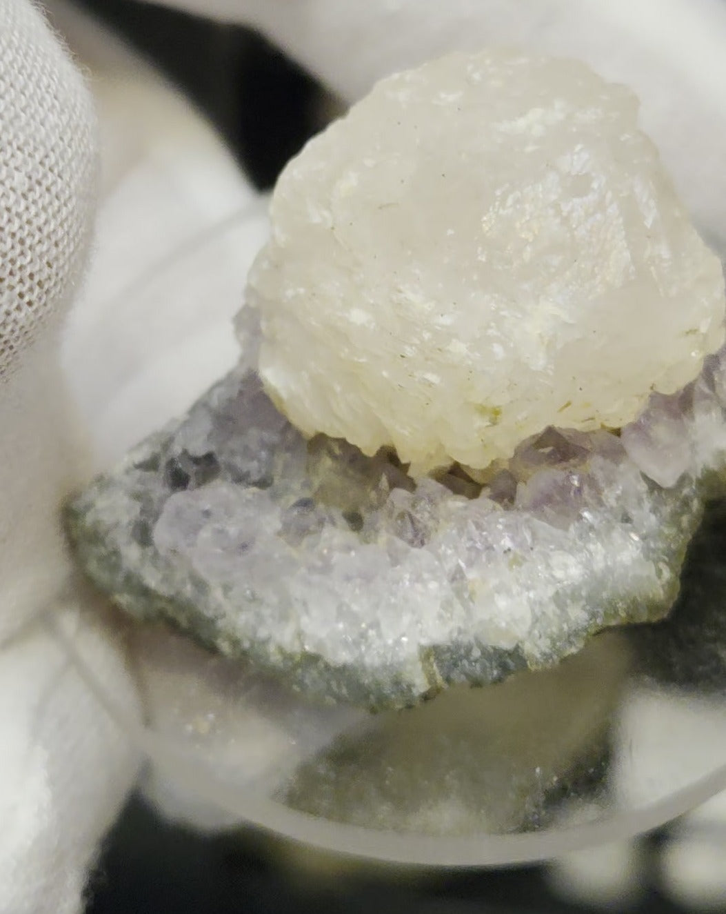 Botryoidal calcite on amethyst cluster specimen