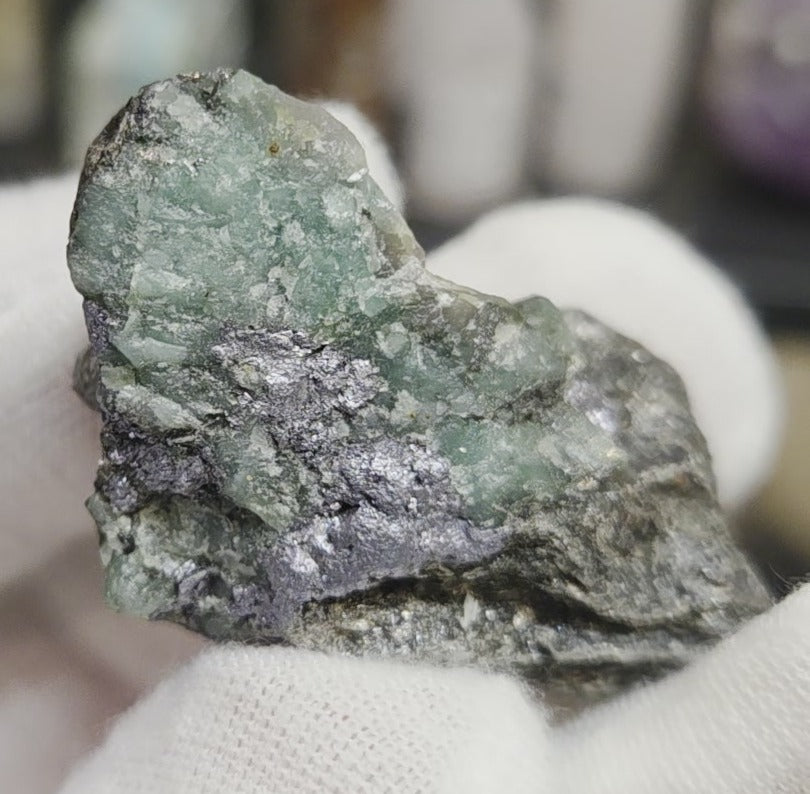 Raw green emerald on matrix specimen