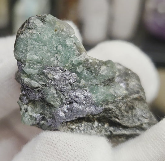 Raw green emerald on matrix specimen