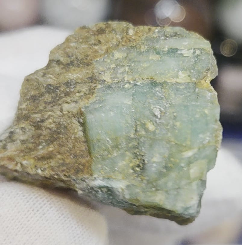 Raw green emerald on matrix specimen