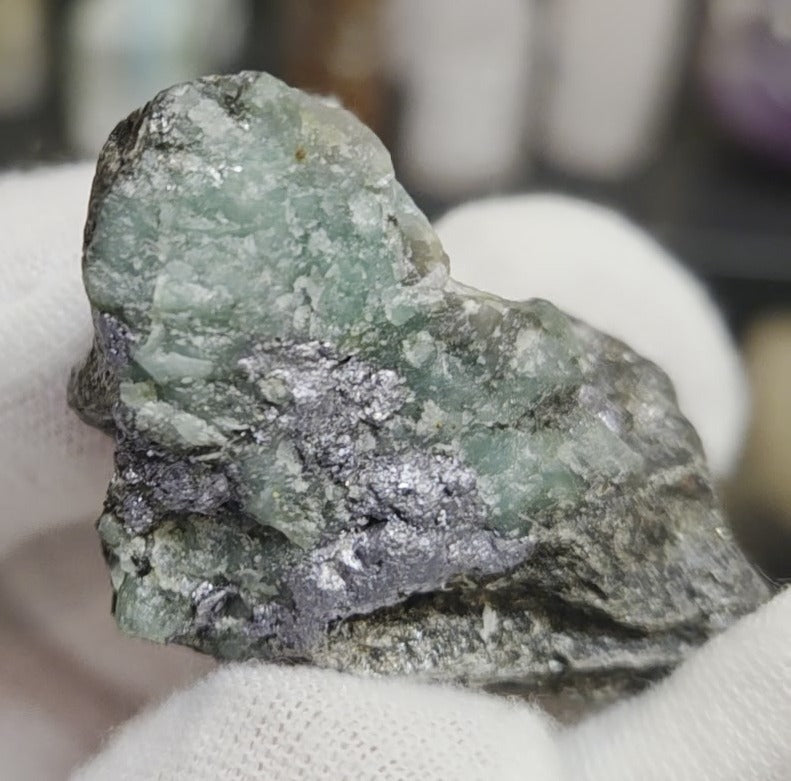 Raw green emerald on matrix specimen