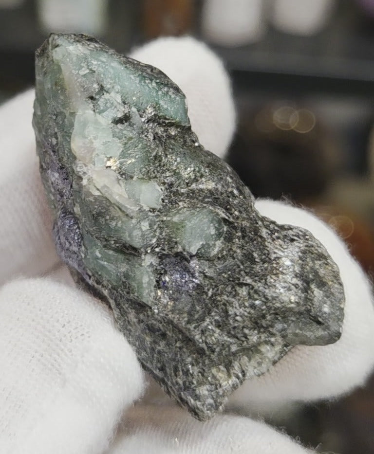 Raw green emerald on matrix specimen