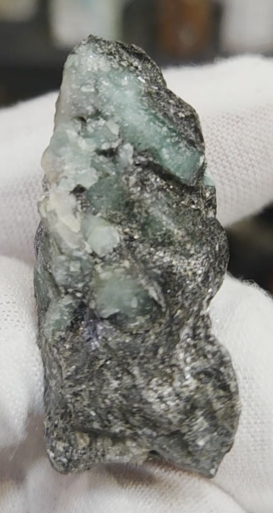 Raw green emerald on matrix specimen