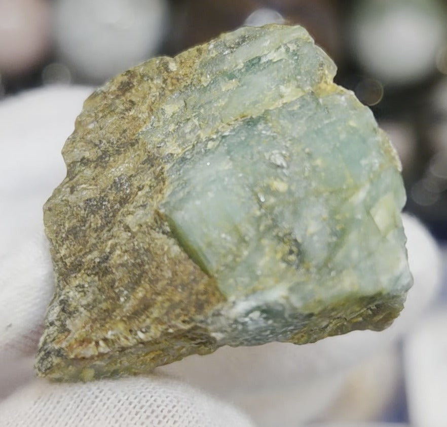 Raw green emerald on matrix specimen