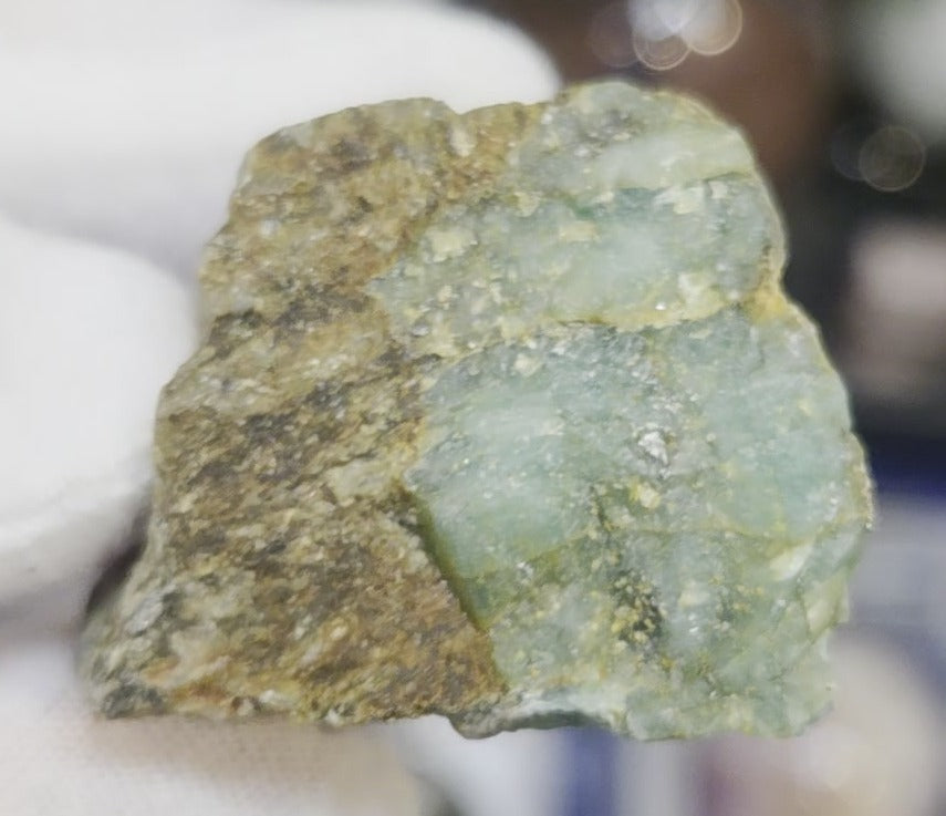 Raw green emerald on matrix specimen