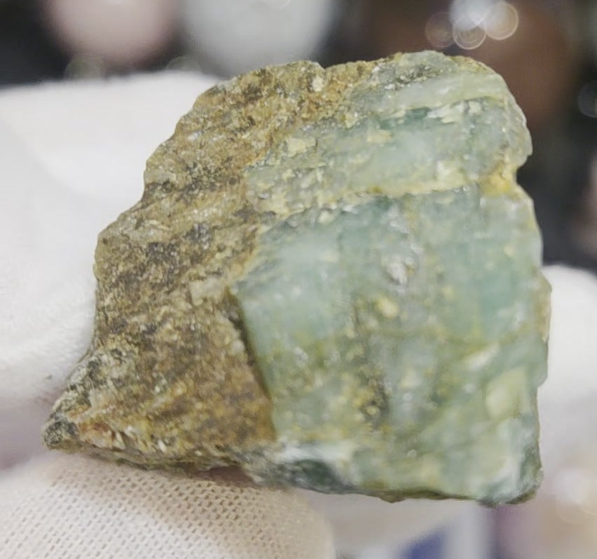 Raw green emerald on matrix specimen