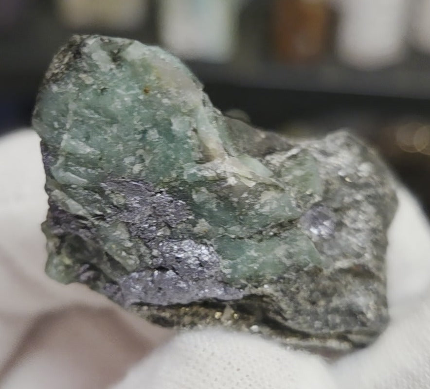 Raw green emerald on matrix specimen