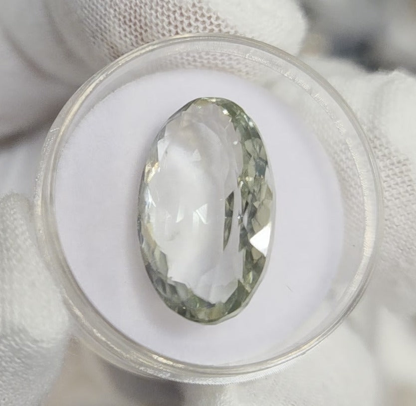 Green amethyst faceted oval gemstone, back side