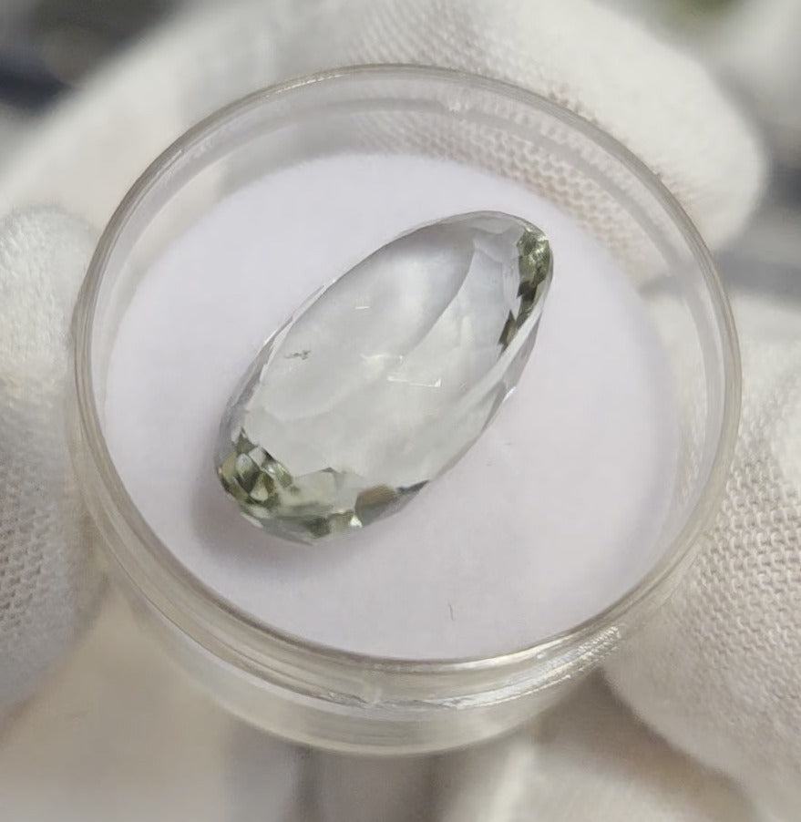 Green amethyst faceted oval gemstone, back side