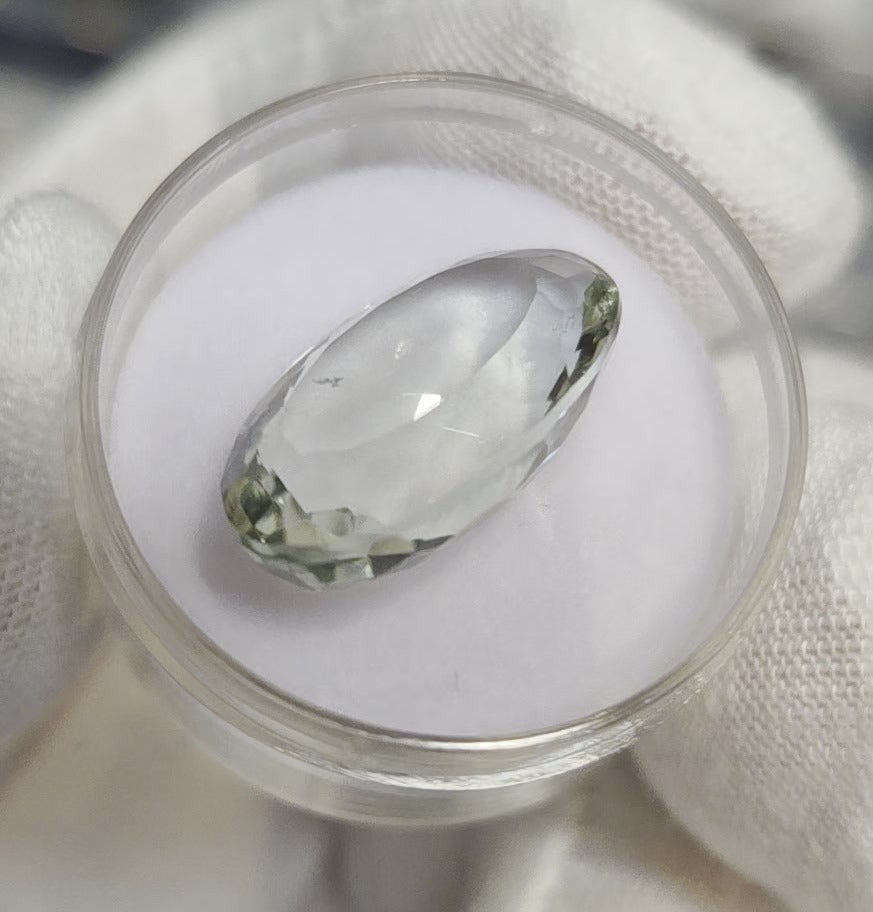 Green amethyst faceted oval gemstone, back side