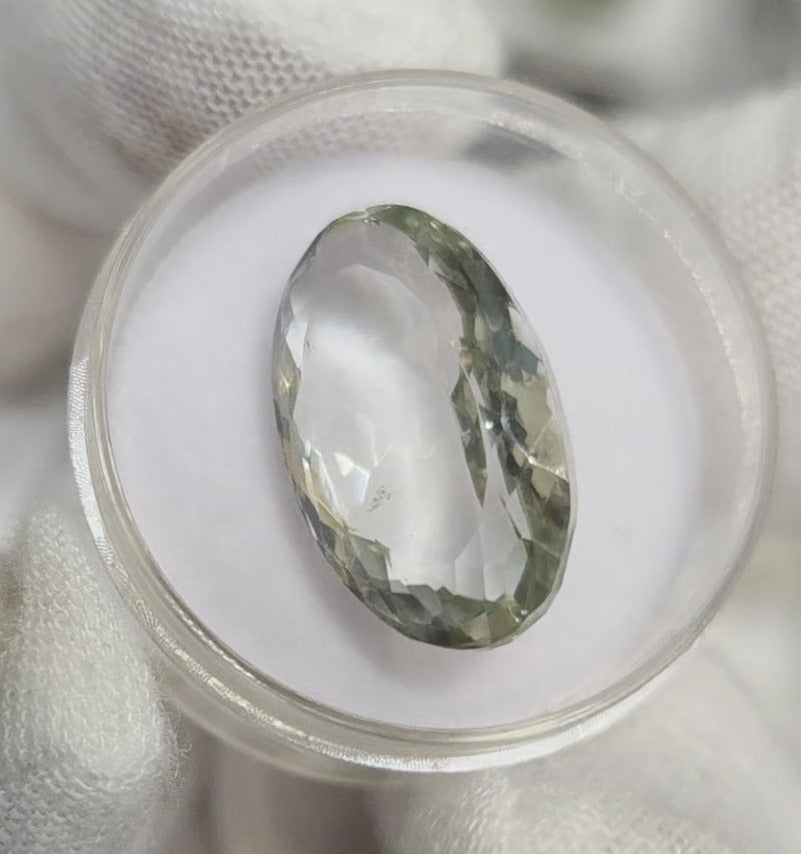 Green amethyst faceted oval gemstone, back side