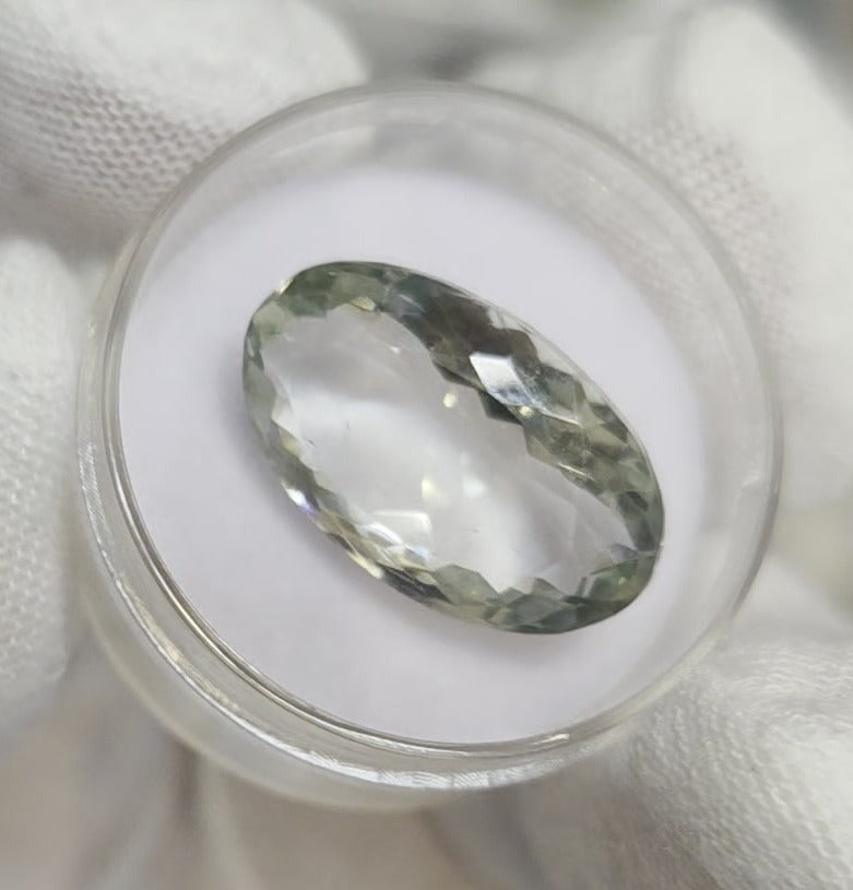 Green amethyst faceted oval gemstone, back side