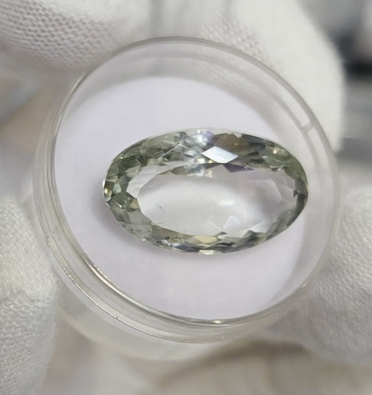 Green amethyst faceted oval gemstone, back side