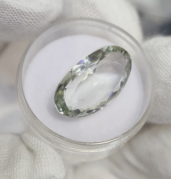 Green amethyst faceted oval gemstone, back side