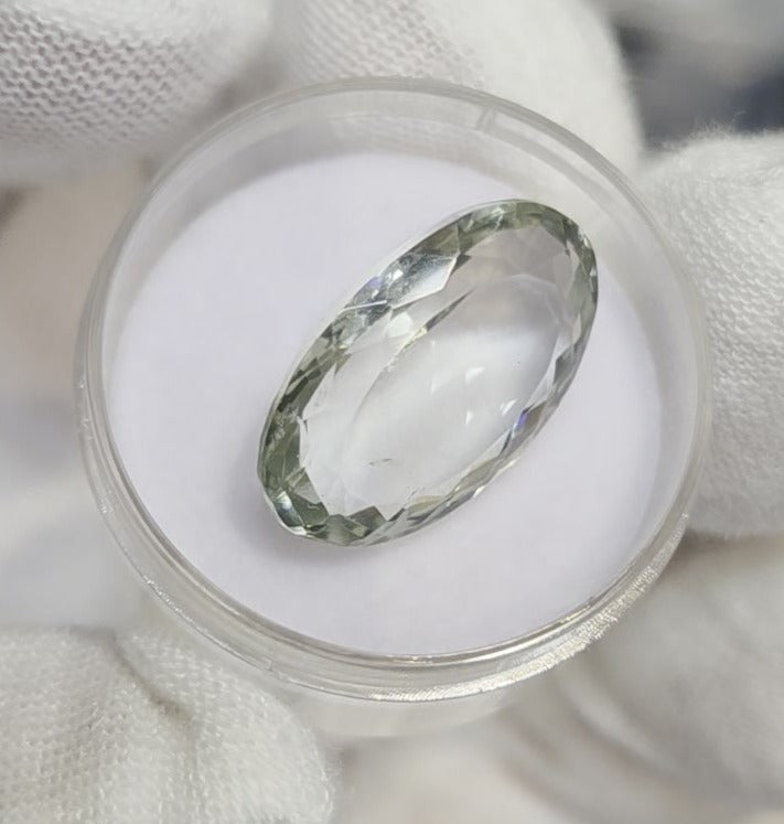 Green amethyst faceted oval gemstone, back side