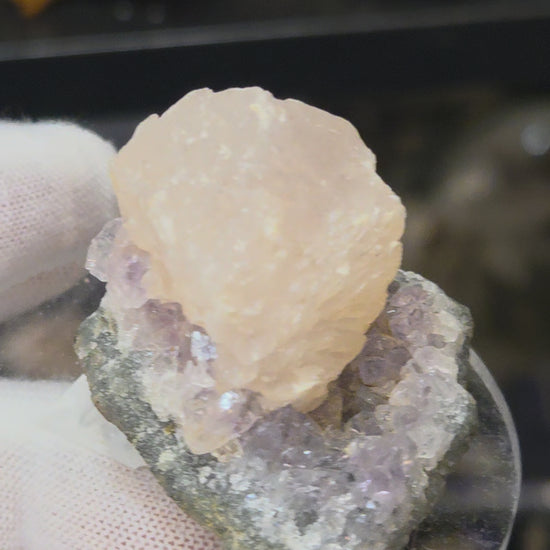 Botryoidal calcite on amethyst cluster specimen