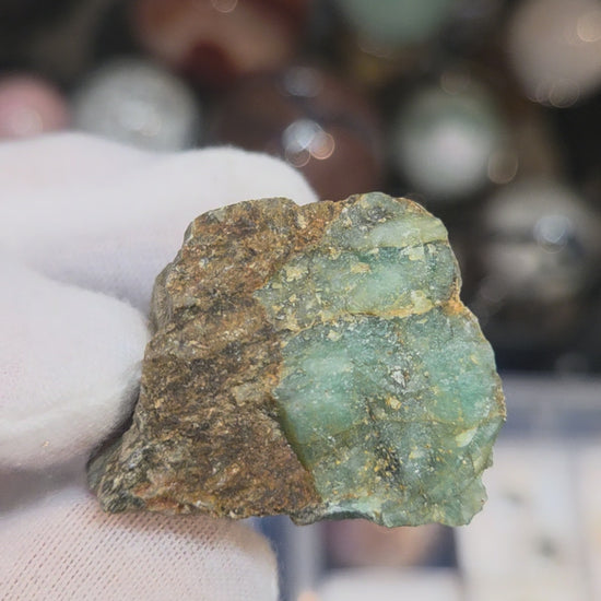 Raw green emerald on matrix specimen