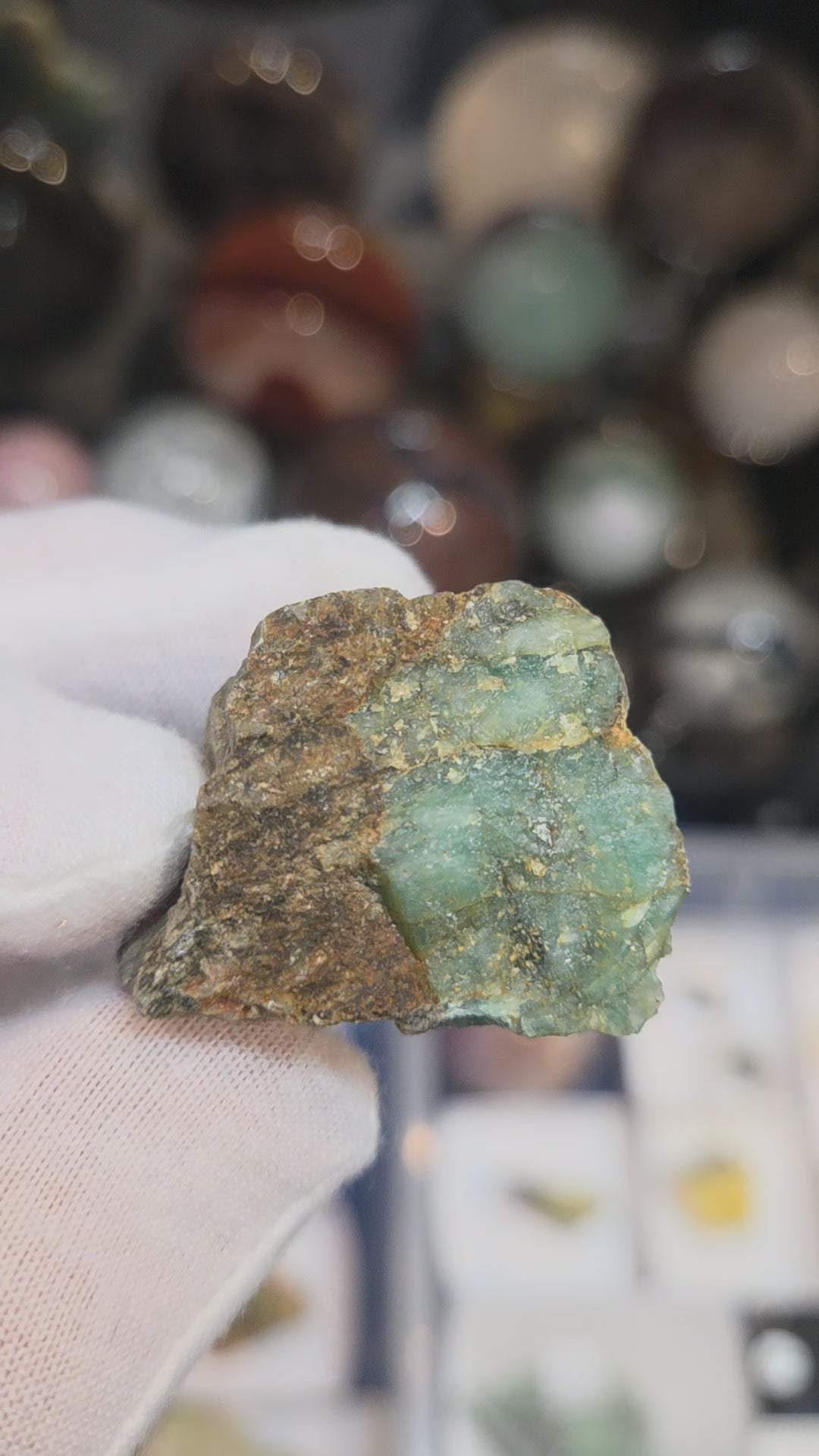 Raw green emerald on matrix specimen