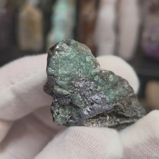 Raw green emerald on matrix specimen