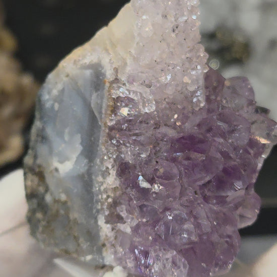 Sugar druzy calcite on amethyst cluster specimen