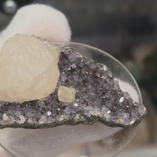 Botryoidal calcite on amethyst cluster specimen