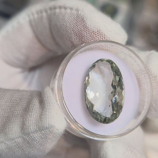 Green amethyst faceted oval gemstone, back side
