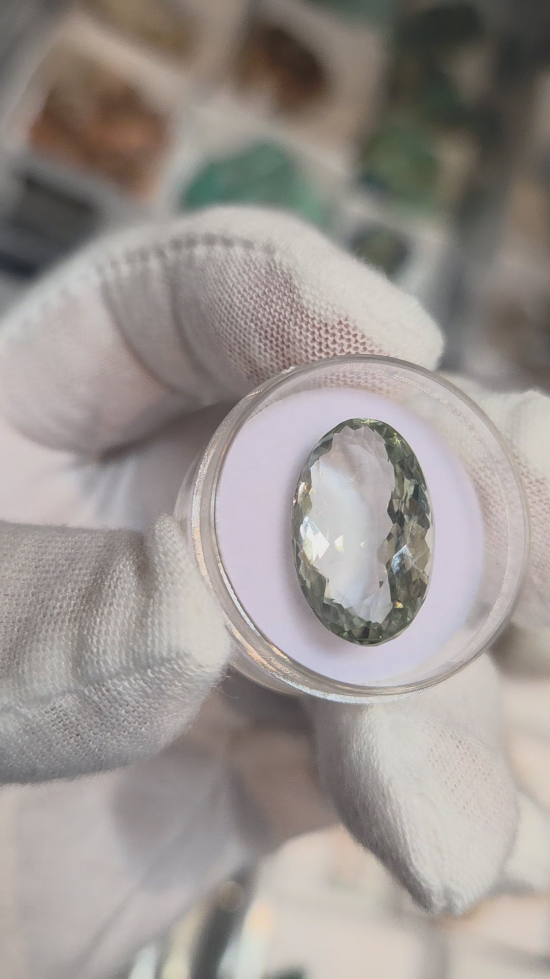 Green amethyst faceted oval gemstone, back side