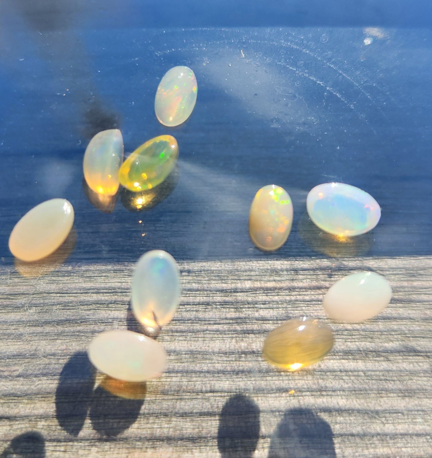 Natural Ethiopian Fire Opal Lot – 10 Faceted Cabochon Gems (Approx. 1.5 Carats Total) | Flashy Play-of-Color, Jewelry & Collector Quality!