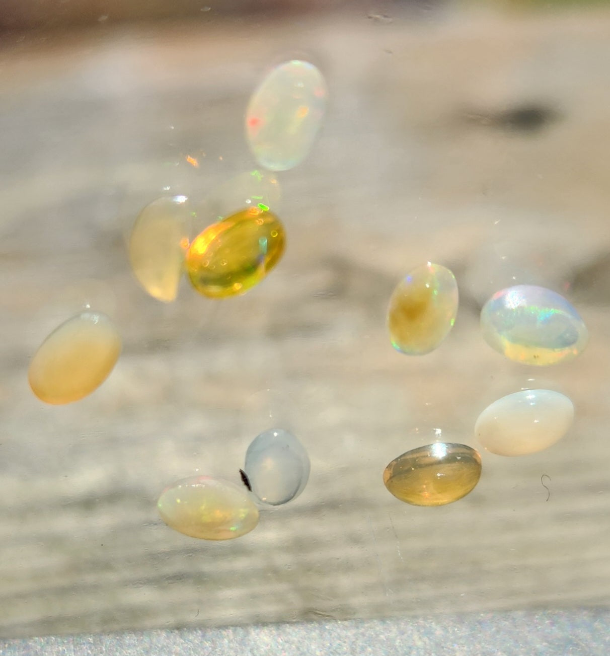 Natural Ethiopian Fire Opal Lot – 10 Faceted Cabochon Gems (Approx. 1.5 Carats Total) | Flashy Play-of-Color, Jewelry & Collector Quality!