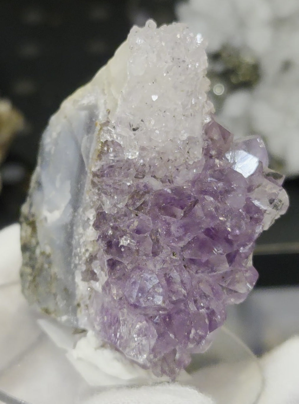 Sugar druzy calcite on amethyst cluster specimen