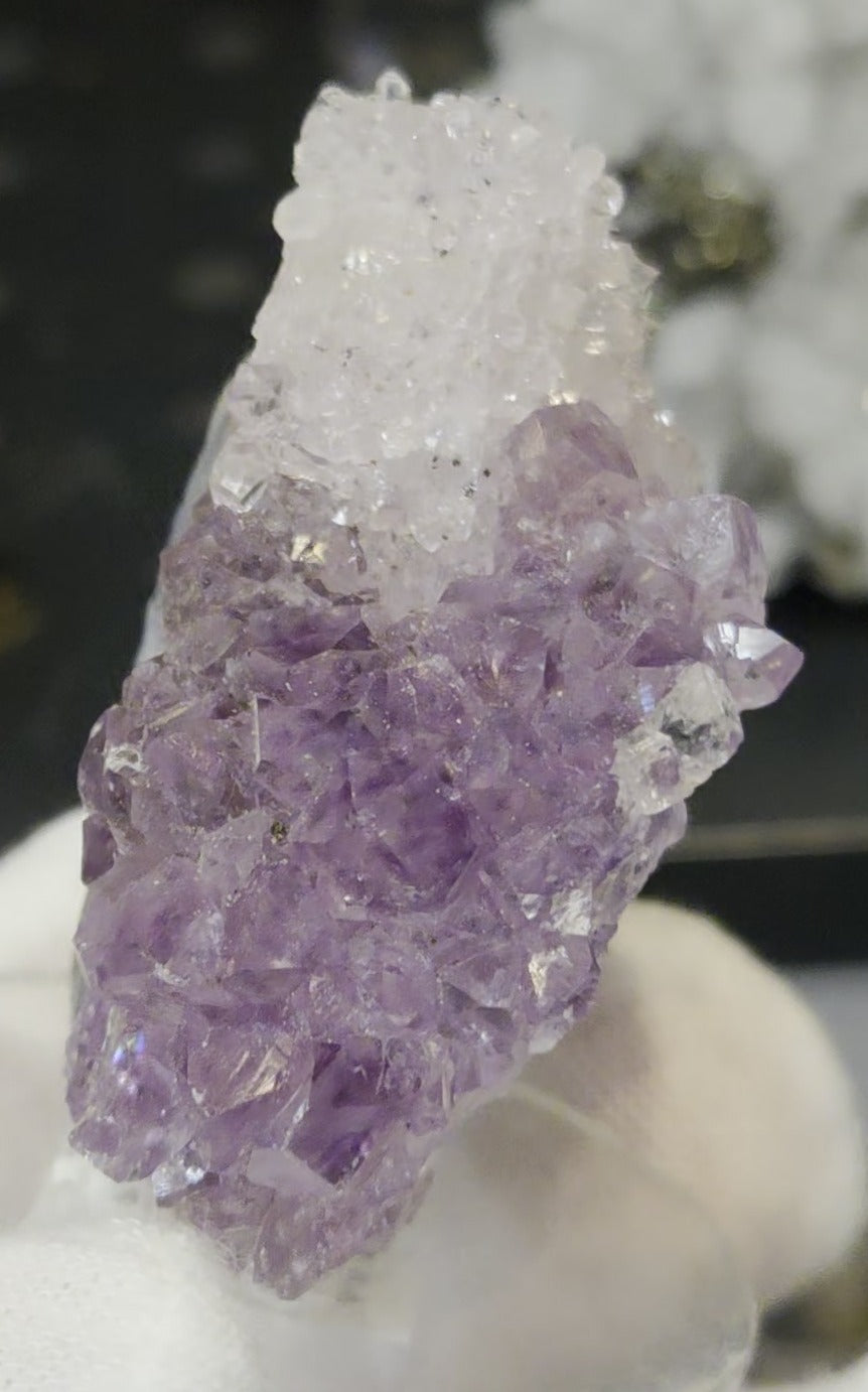 Sugar druzy calcite on amethyst cluster specimen