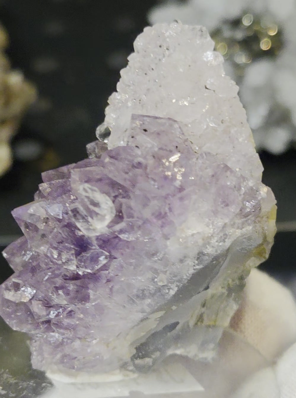 Sugar druzy calcite on amethyst cluster specimen