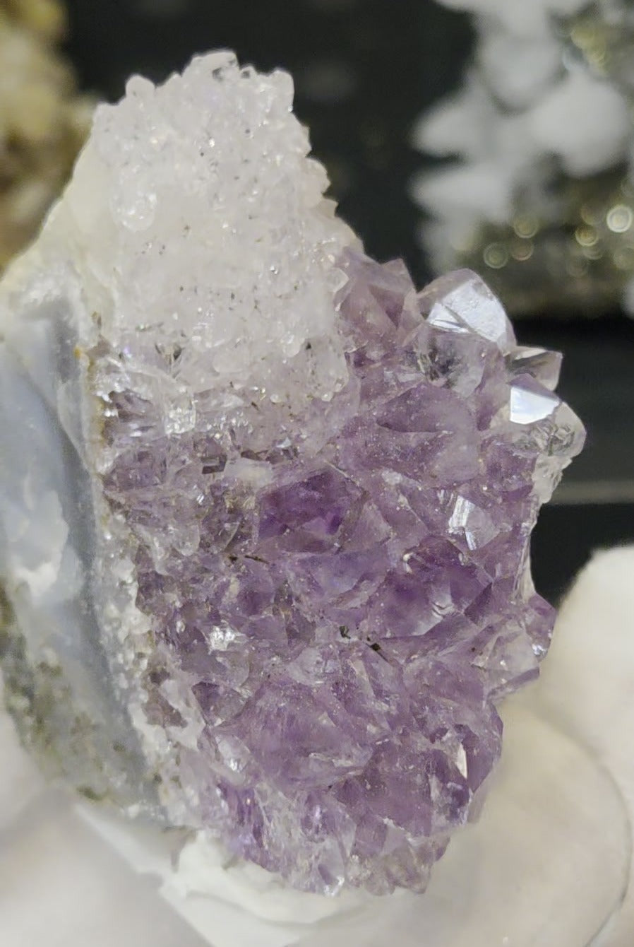 Sugar druzy calcite on amethyst cluster specimen