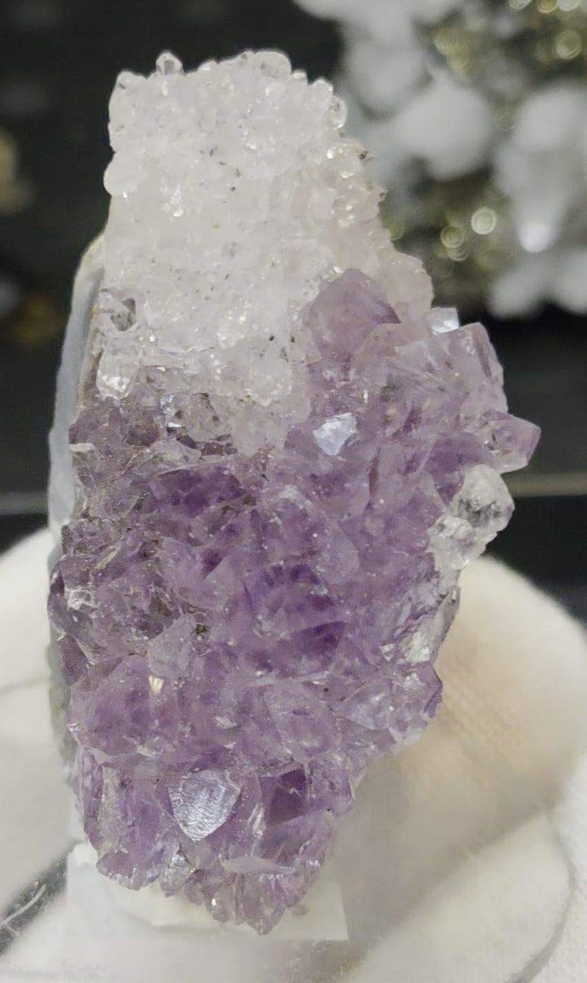 Sugar druzy calcite on amethyst cluster specimen